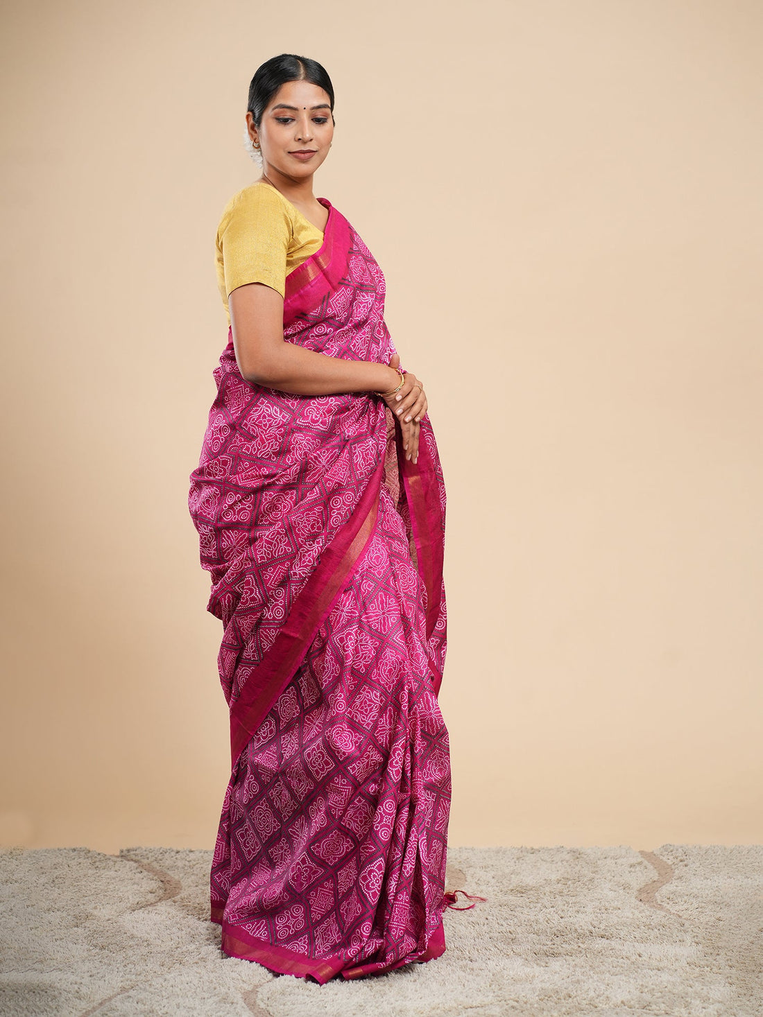 Magenta Chanderi Bandhani-print saree draped full-length, white resist dots across the body — Koshnika