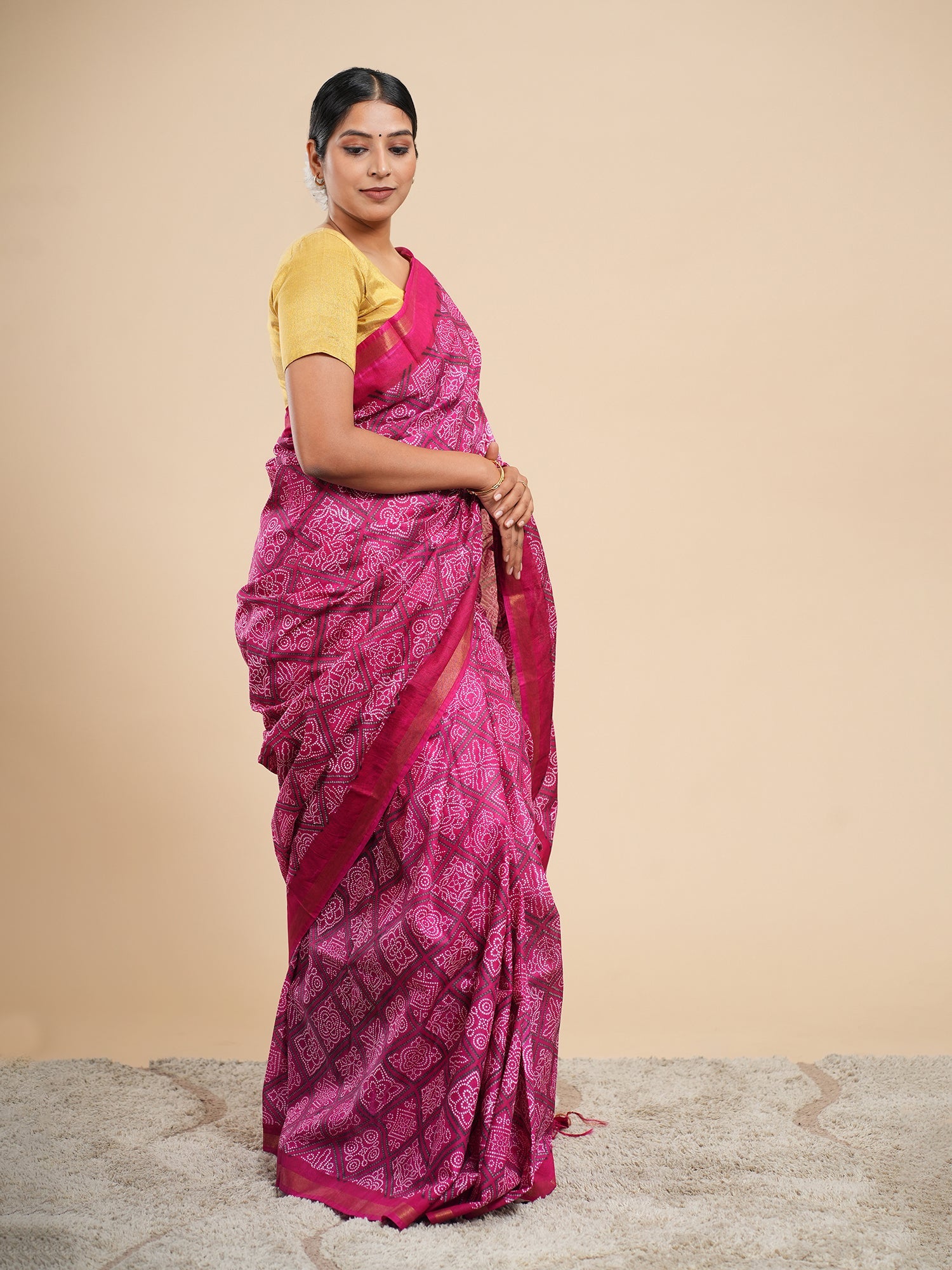 Magenta Chanderi Bandhani-print saree draped full-length, white resist dots across the body — Koshnika