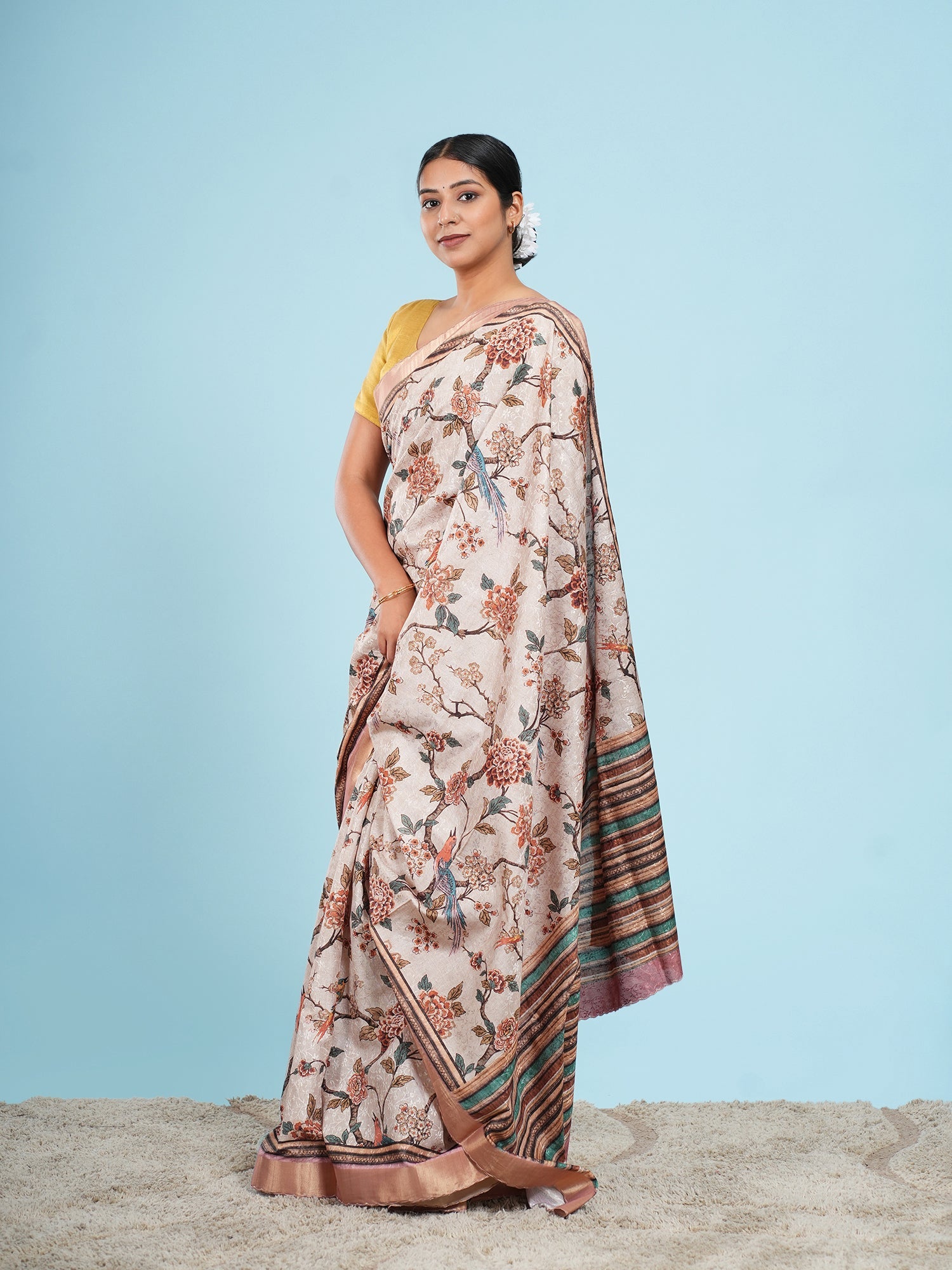 Soft beige self-jacquard saree draped full-length, showing pleat width and fall — Koshnika