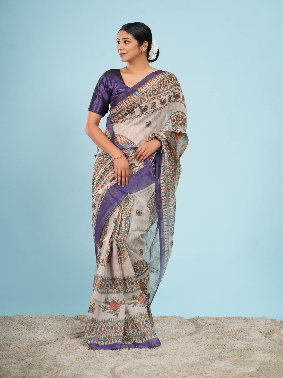 Beige and purple Tussar silk saree draped full-length, showing how a Tussar silk saree falls — Koshnika